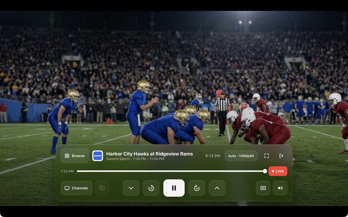 The player controls over a live football game: a glass bar with large channel, skip, play, live and caption buttons.